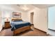 Cozy bedroom featuring a comfortable bed and classic decor at 6051 Ivanhoe St, Commerce City, CO 80022
