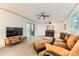 Inviting living room with plush seating and a decorative fireplace at 6051 Ivanhoe St, Commerce City, CO 80022
