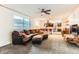 Comfortable living room with cozy seating and carpeted floors at 6051 Ivanhoe St, Commerce City, CO 80022