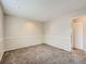 Large carpeted basement featuring neutral walls, updated lighting, and an open closet at 8267 High St, Denver, CO 80229
