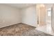 Finished basement featuring neutral paint, base trim, and an access door to the nearby bathroom at 8267 High St, Denver, CO 80229