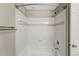 Clean and tidy tub and shower combo bathroom featuring white tiled walls at 7483 S Quail Cir # 626, Littleton, CO 80127
