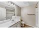 Well-lit bathroom featuring a single sink vanity, shower, and toilet at 7483 S Quail Cir # 626, Littleton, CO 80127