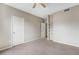 Bright, empty bedroom with neutral carpeting, a ceiling fan, and closet at 7483 S Quail Cir # 626, Littleton, CO 80127