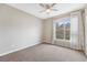 Sunny bedroom with a large window that lets in natural light and neutral carpeting at 7483 S Quail Cir # 626, Littleton, CO 80127
