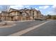 Exterior view of the condo building showing garages and balconies at 7483 S Quail Cir # 626, Littleton, CO 80127