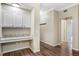 Hallway with custom shelving unit, granite countertops and ample storage space at 7483 S Quail Cir # 626, Littleton, CO 80127