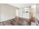 Open living space with hardwood floors, neutral walls, and view to kitchen at 7483 S Quail Cir # 626, Littleton, CO 80127