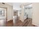 Open living space with hard surface floors leads to sliding glass door and eat-in kitchen at 7483 S Quail Cir # 626, Littleton, CO 80127