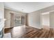 Bright living room with hardwood floors, large sliding doors to balcony, and neutral paint at 7483 S Quail Cir # 626, Littleton, CO 80127