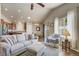 Comfortable living room featuring a cozy sofa, fireplace, and an open layout at 6812 Indian Paintbrush St, Frederick, CO 80530