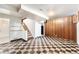 Spacious basement area with checkerboard flooring, offering versatile potential for entertainment or storage at 7172 Kalamath St, Denver, CO 80221