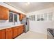Bright kitchen with white countertops, wood cabinets, stainless steel appliances, and modern fixtures at 7172 Kalamath St, Denver, CO 80221
