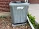 Frigidaire central air conditioner unit, set on a stone bed, ensures efficient cooling at 1152 S Eaton St, Lakewood, CO 80232