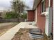 Brick house featuring a patio and sliding glass door leading to a private backyard at 1152 S Eaton St, Lakewood, CO 80232