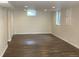 Finished basement offering a spacious area, neutral color palette, and plank flooring at 1152 S Eaton St, Lakewood, CO 80232