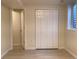 Basement bedroom featuring a closet, open doorway and wood-look floors at 1152 S Eaton St, Lakewood, CO 80232