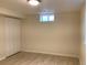 Basement bedroom showcasing wood-look flooring, window, and closet at 1152 S Eaton St, Lakewood, CO 80232