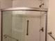 An enclosed shower with clear sliding glass and white subway tile at 1152 S Eaton St, Lakewood, CO 80232