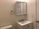 Bathroom sink with vanity, updated faucet, lighting and towel rack, with mirror medicine cabinet at 1152 S Eaton St, Lakewood, CO 80232
