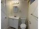 A well-lit bathroom features a modern vanity with a white cabinet and a toilet with neutral walls at 1152 S Eaton St, Lakewood, CO 80232