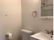 Clean bathroom with toilet, vanity, and medicine cabinet, plus towel rack at 1152 S Eaton St, Lakewood, CO 80232