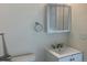 Modern bathroom featuring a sink with a vanity and a mirrored cabinet at 1152 S Eaton St, Lakewood, CO 80232