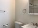 Clean bathroom featuring a white toilet, sink, and a mirrored cabinet at 1152 S Eaton St, Lakewood, CO 80232