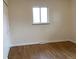 Bright bedroom with hardwood floors, double closet and natural light from the window at 1152 S Eaton St, Lakewood, CO 80232