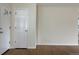 Entryway featuring hardwood floors, neutral paint, and two white doors at 1152 S Eaton St, Lakewood, CO 80232