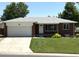 Charming single-story brick home features a well-manicured lawn, attached garage and a welcoming entrance at 1152 S Eaton St, Lakewood, CO 80232