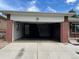 Attached home garage showcasing a large open space and brick build at 1152 S Eaton St, Lakewood, CO 80232