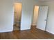 Hallway with hardwood floors leads to bath and bedrooms at 1152 S Eaton St, Lakewood, CO 80232