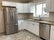 An eat-in kitchen features stainless appliances, granite counters, and white subway tile backsplash at 1152 S Eaton St, Lakewood, CO 80232