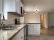 Kitchen featuring granite countertops, stainless steel appliances, and an open layout at 1152 S Eaton St, Lakewood, CO 80232