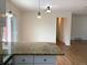 Bright kitchen features a granite island, recessed lighting, and a sliding glass door at 1152 S Eaton St, Lakewood, CO 80232