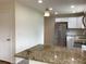 Eat in kitchen area with stainless steel appliances, granite countertops, and recessed lighting at 1152 S Eaton St, Lakewood, CO 80232