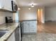 Kitchen features stainless appliances, granite countertops, and white cabinets at 1152 S Eaton St, Lakewood, CO 80232