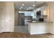 Modern kitchen featuring white cabinets, stainless steel appliances, and granite countertops at 1152 S Eaton St, Lakewood, CO 80232