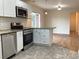 Recently renovated kitchen features stainless steel appliances, granite countertops and an open floor plan at 1152 S Eaton St, Lakewood, CO 80232