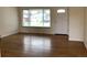 The home features beautiful hardwood floors and lots of natural light from a large window at 1152 S Eaton St, Lakewood, CO 80232