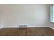 Living room featuring hardwood floors, neutral paint, and a window with blinds at 1152 S Eaton St, Lakewood, CO 80232