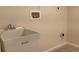 A white utility sink with chrome faucet set against a neutral wall, complemented by modern fixtures at 1152 S Eaton St, Lakewood, CO 80232