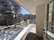 Balcony with beautiful view of snow-covered trees and landscaping at 22148 Red Hawk Ln, Golden, CO 80401