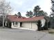 Charming ranch-style home with red tile roof and three-car garage at 22148 Red Hawk Ln, Golden, CO 80401