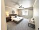 Spacious main bedroom with ceiling fan, bench, and a large window at 22148 Red Hawk Ln, Golden, CO 80401