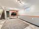 Finished basement showcasing a large entertainment area with stylish flooring and lighting at 11707 W 65Th Cir, Arvada, CO 80004