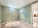 Cozy room with neutral carpet, fresh paint, and natural light coming from a window at 11707 W 65Th Cir, Arvada, CO 80004
