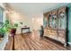 Open-concept living room with hardwood floors, lots of space and natural light at 11707 W 65Th Cir, Arvada, CO 80004