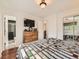 Spacious main bedroom with hardwood floors, a dresser, and an ensuite bathroom with a glass-enclosed shower at 11707 W 65Th Cir, Arvada, CO 80004